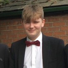 Portrait picture of Harry Gledhill in a suit.