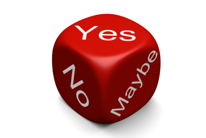Dice with three sides on view saying 'Yes', 'No' and 'Maybe'