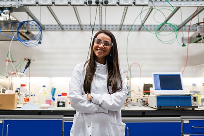 Photograph of young woman in lab wear